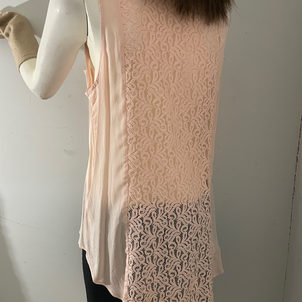 Gorgeous peach sleeveless blouse serious